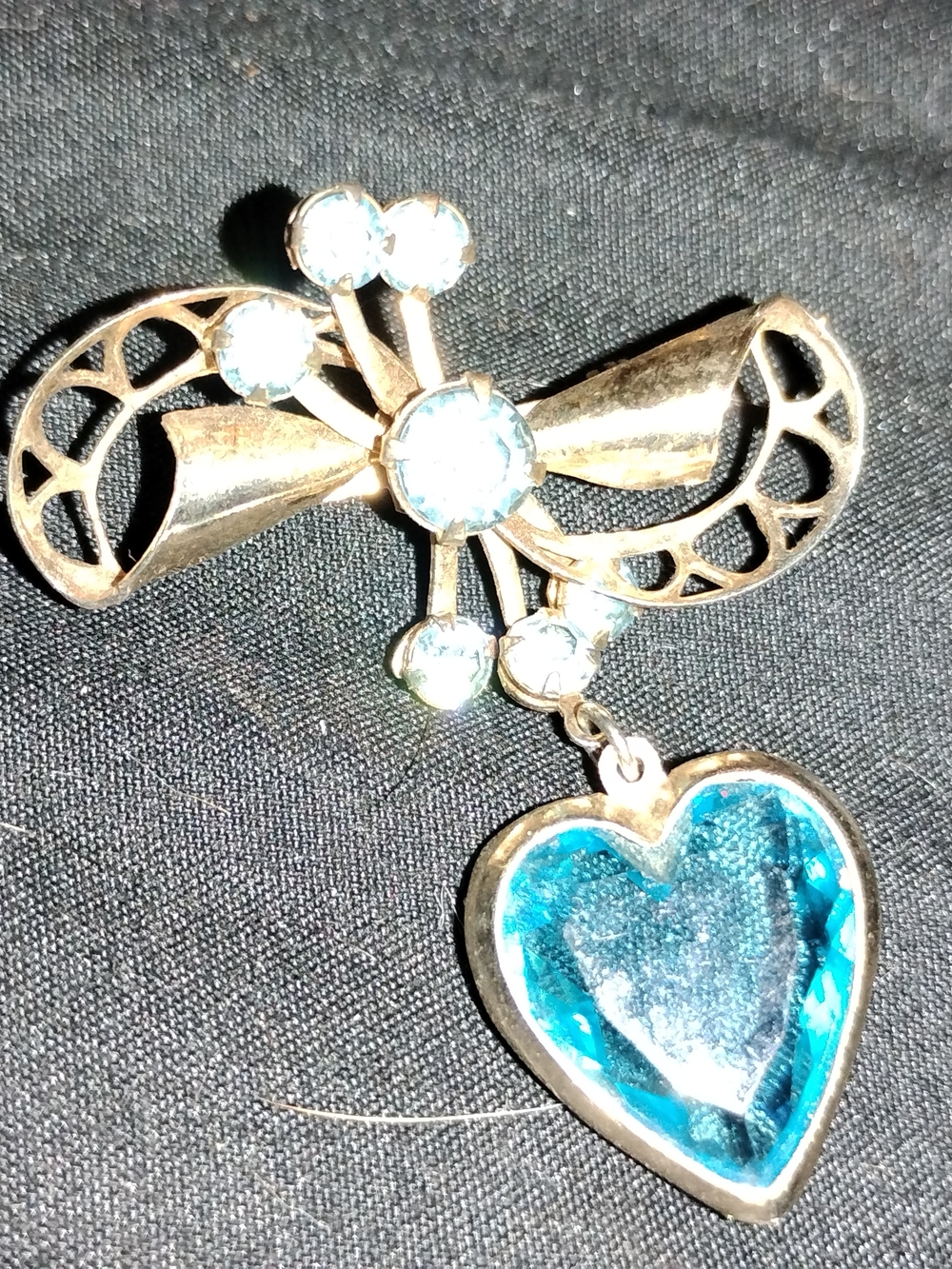 Gold-Tone Bow Brooch with Blue Heart Pendant